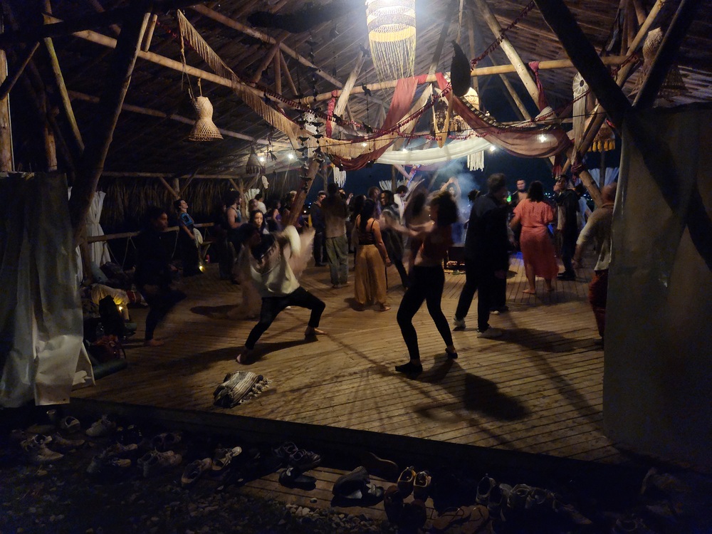 Dancers moving freely, ecstatic dance night